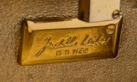 A Judith Leiber Silver Crystal Minaudiere, 5.5" x 2.5" x 1.2".