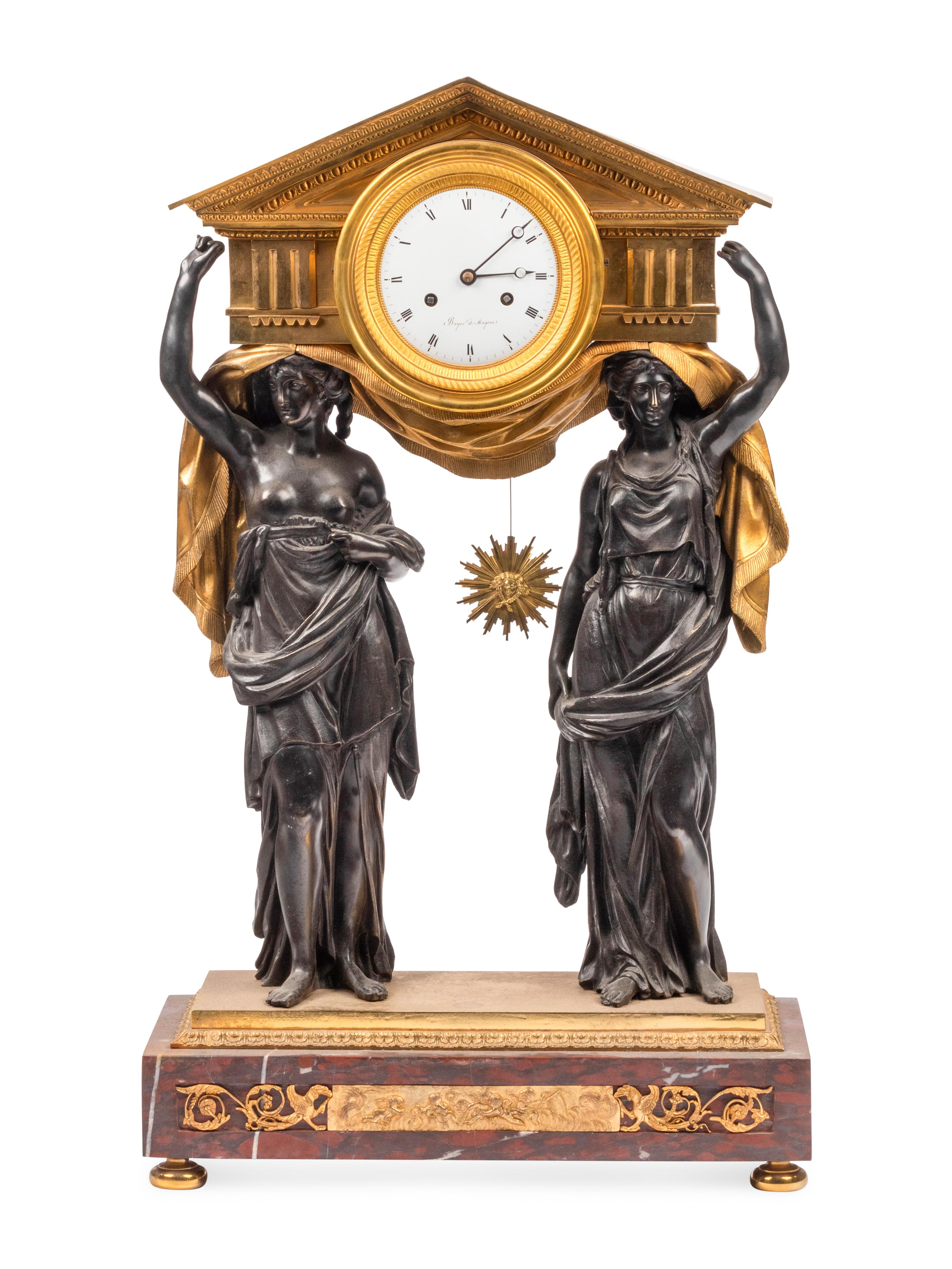 A Large French Gilt and Patinated Bronze and Rouge Marble Three-Piece Clock Garniture