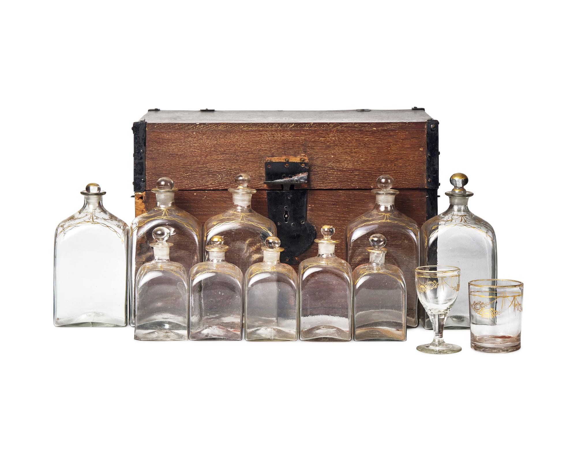 A Federal Oak Liquor Case Fitted with Gilt-Decorated Glass Bottles and Glasses