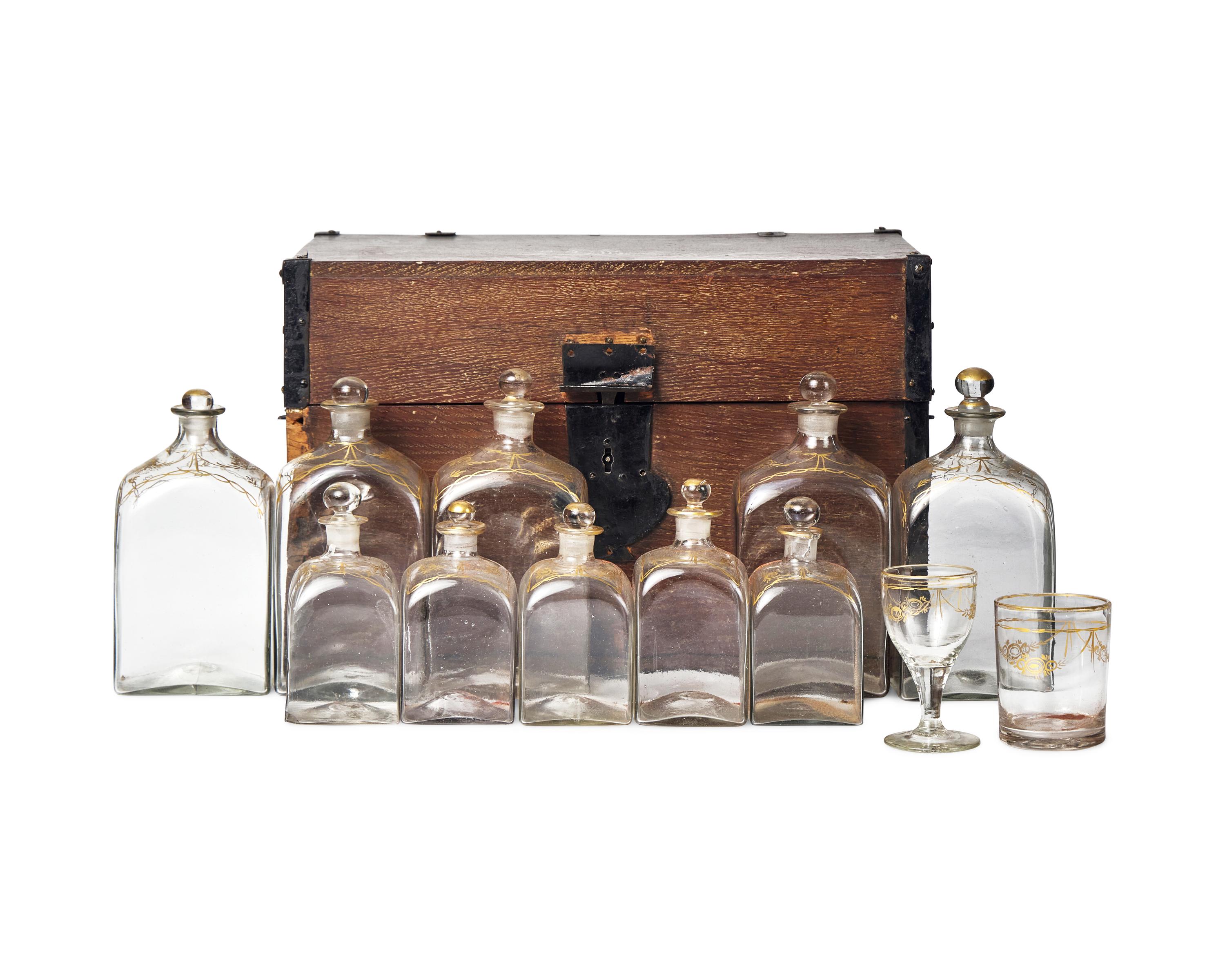 A Federal Oak Liquor Case Fitted with Gilt-Decorated Glass Bottles and Glasses