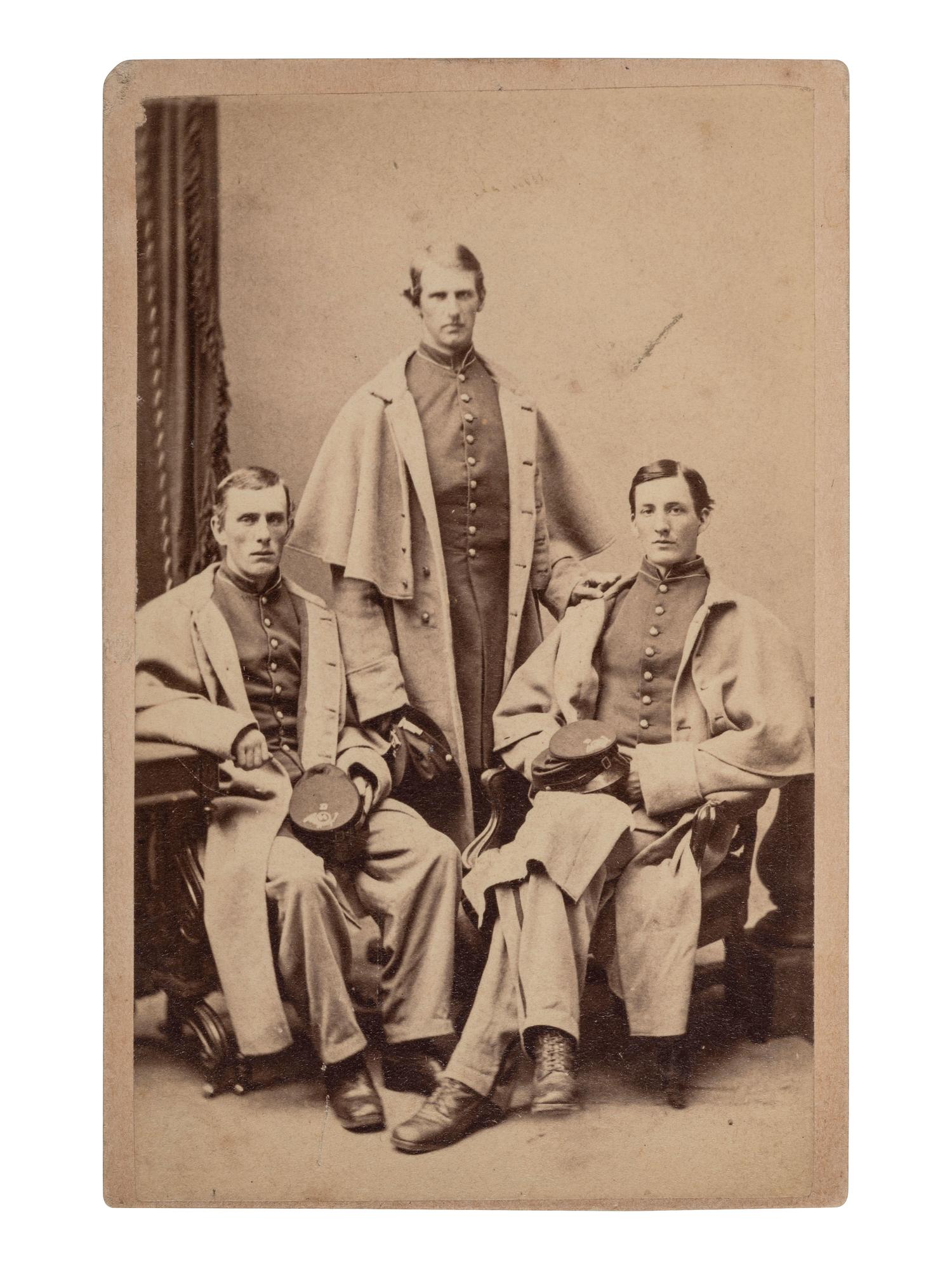 [UNITED STATES COLORED TROOPS]. CDV of three officers, identified on verso as 54th Massachusetts Infantry, USCT. Boston: J. W. Black, ca 1860s.