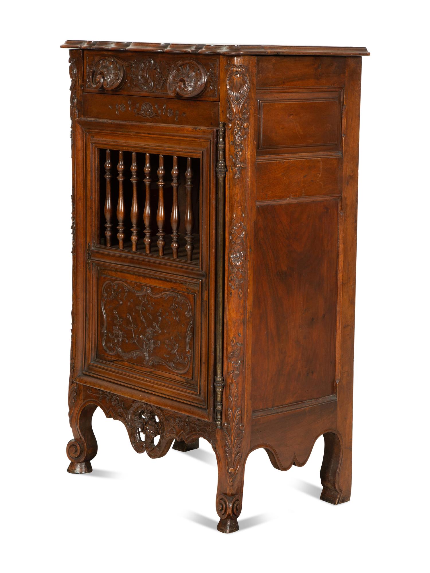 A French Provincial Carved Walnut Panettière