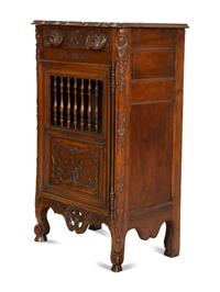 A French Provincial Carved Walnut Panettière
