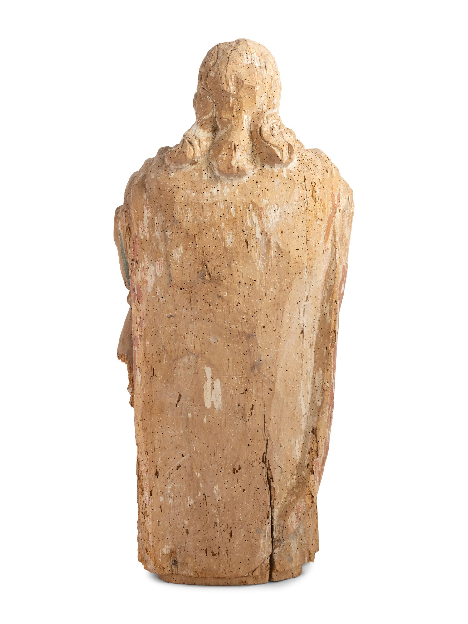 A Continental Carved and Painted Figure of a Saint