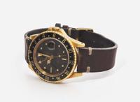 A Men's 18K Yellow Gold Rolex GMT Master