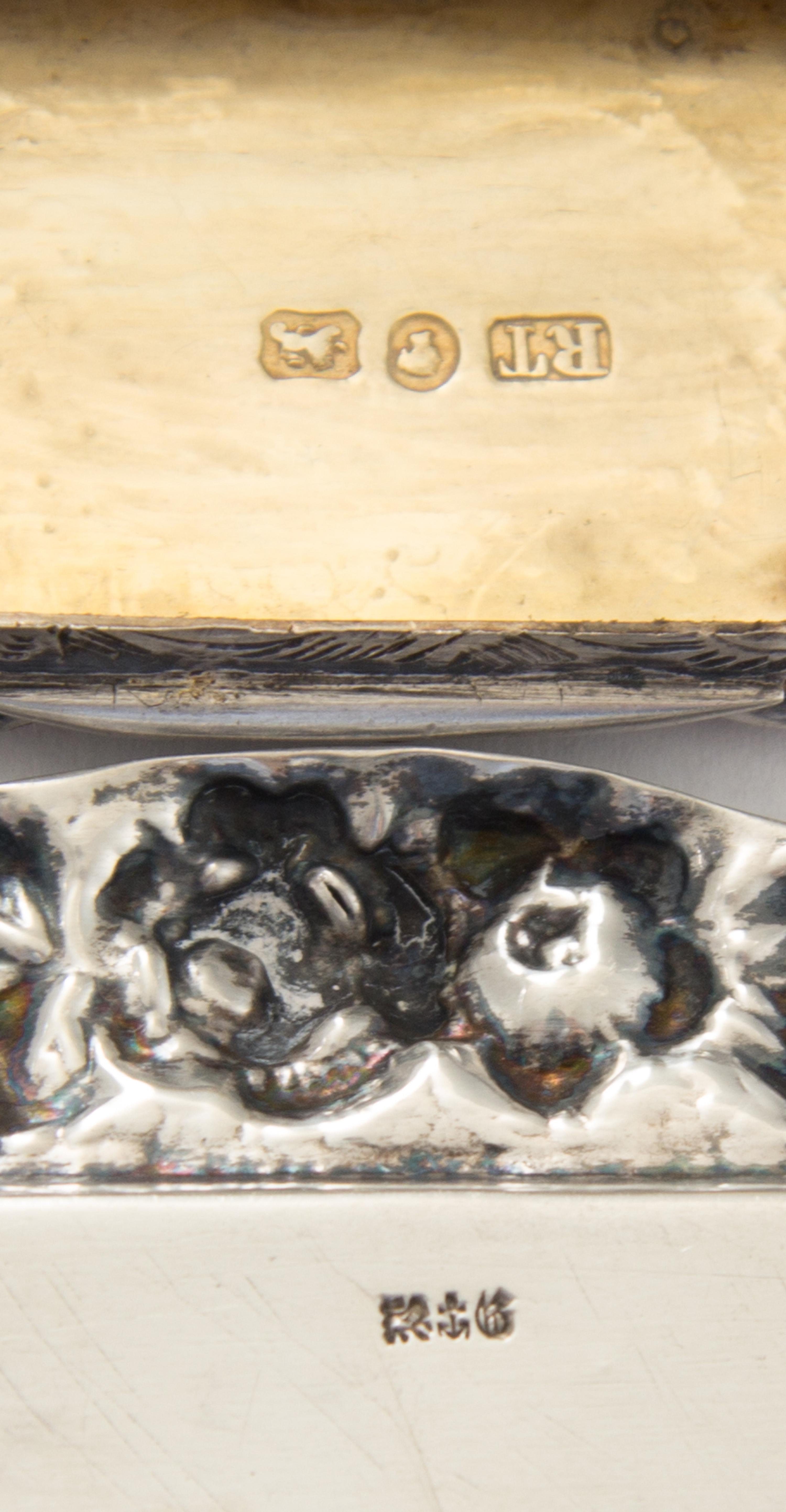 A Victorian Silver Vinaigrette, Robert Thornton, Birmingham, 1870, having a shaped rectangular case, the lid centered by an envgaved mo