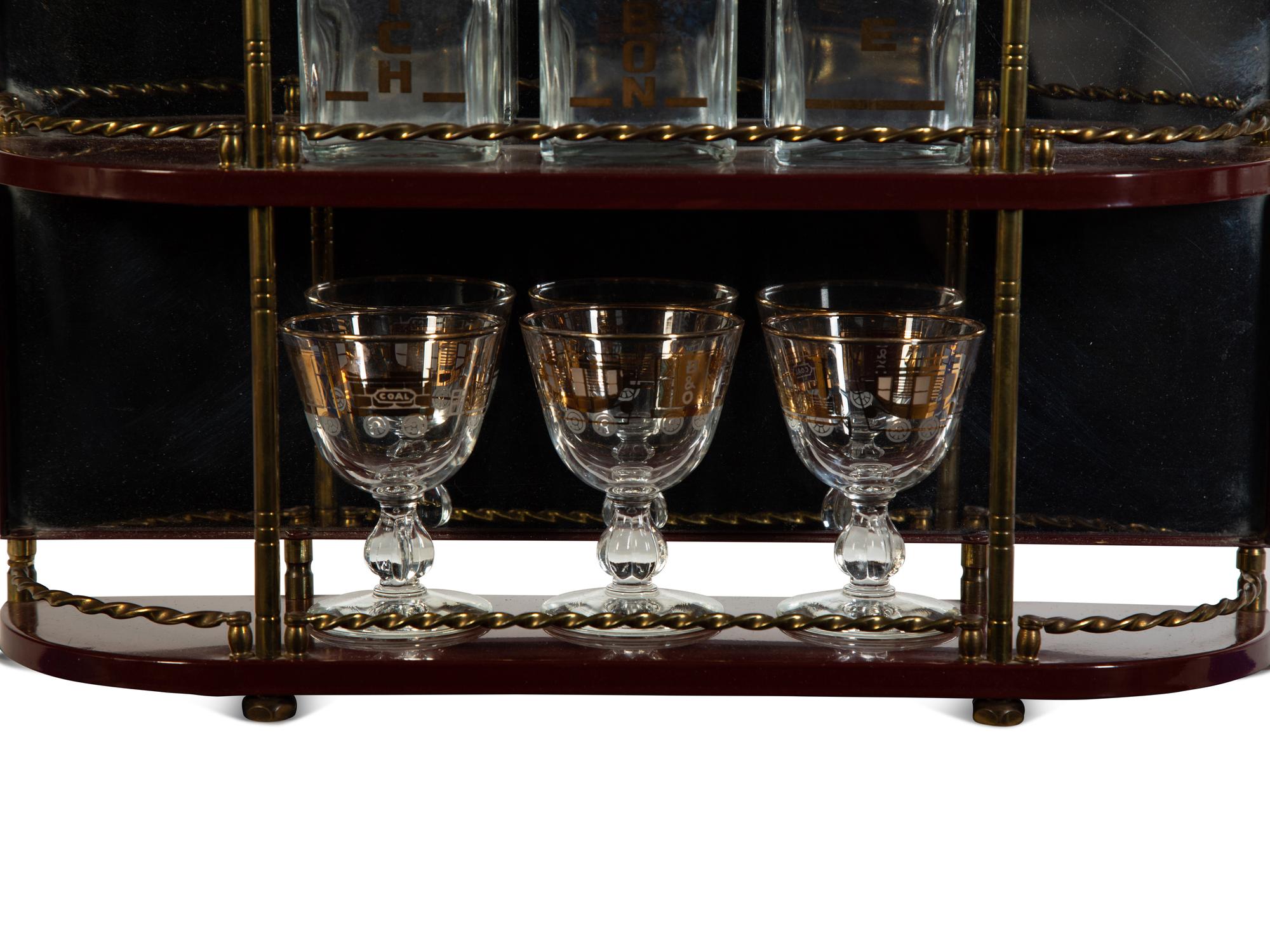 A Brass-Mounted Liquor Rack with Glasses and Tantalus
