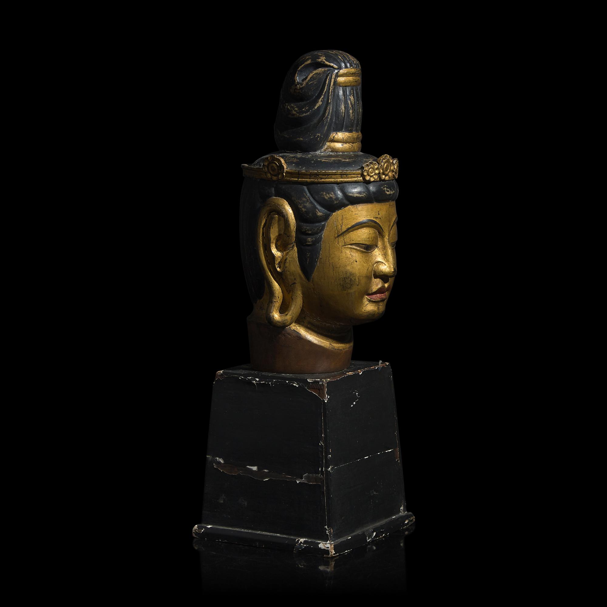 A Japanese Gilt and Black Painted Wood Head of a Bosatsu