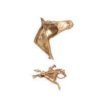 COLLECTION OF YELLOW GOLD HORSE BROOCHES