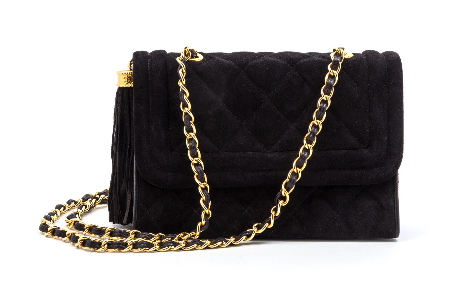 A Chanel Black Quilted Suede Flap Bag, 8 x 5 1/2 x 2 1/2 inches.