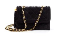 A Chanel Black Quilted Suede Flap Bag, 8 x 5 1/2 x 2 1/2 inches.