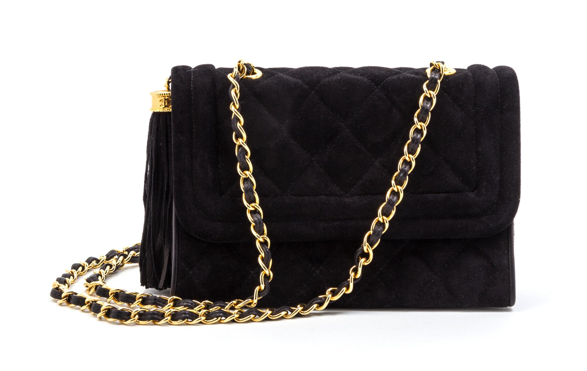 A Chanel Black Quilted Suede Flap Bag, 8 x 5 1/2 x 2 1/2 inches.