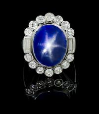 A White Gold, Star Sapphire and Diamond Ring, 17.00 dwts.