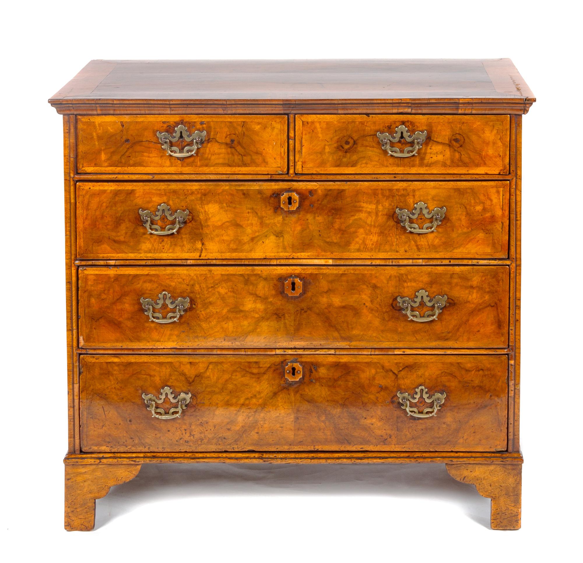 A George II Walnut Chest of Drawers Height 36 1/2 x width 39 1/2 x depth 21 1/2 inches. — MID-18TH CENTURY