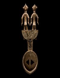 A Bamana Wood Horned Mask with Figures