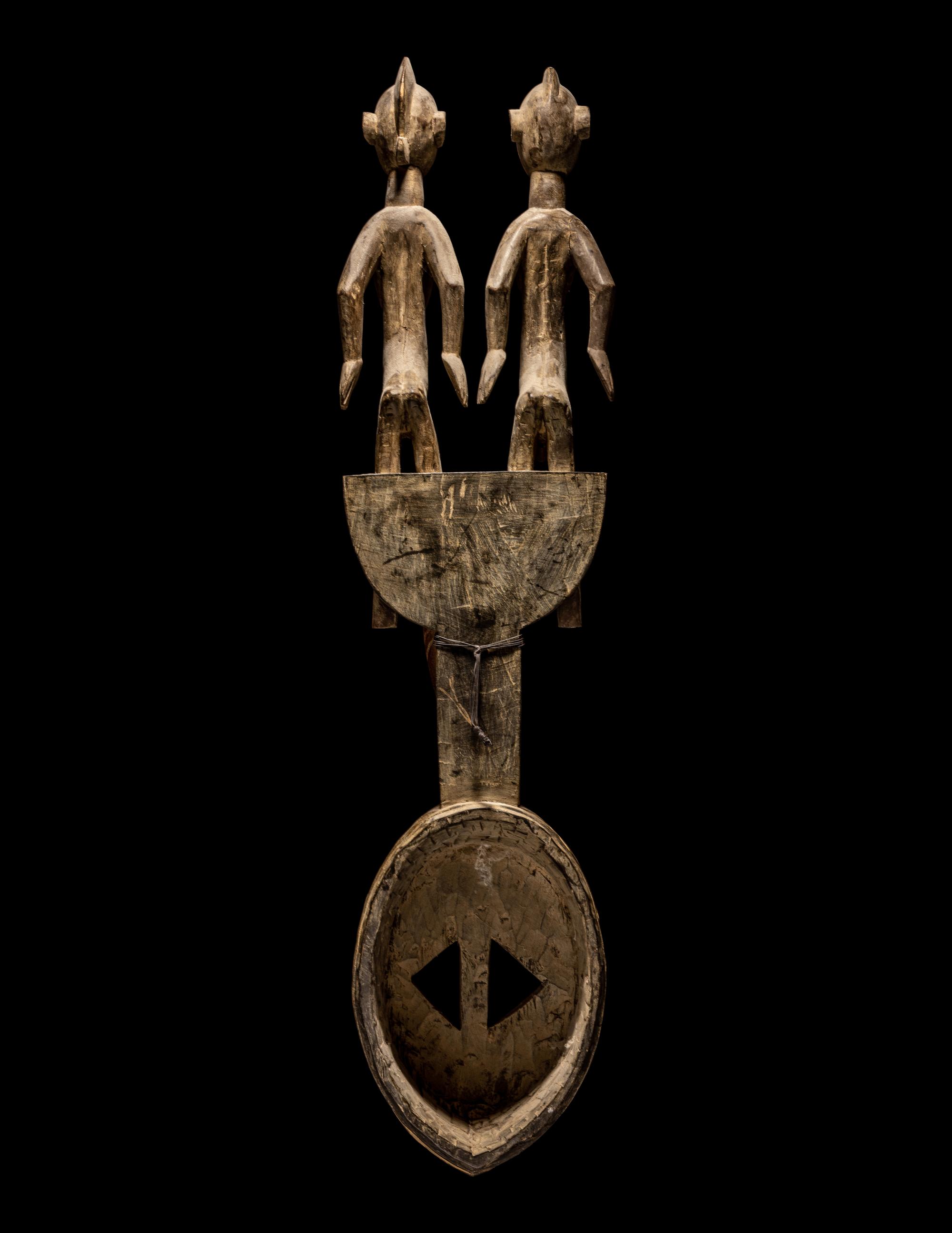 A Bamana Wood Horned Mask with Figures