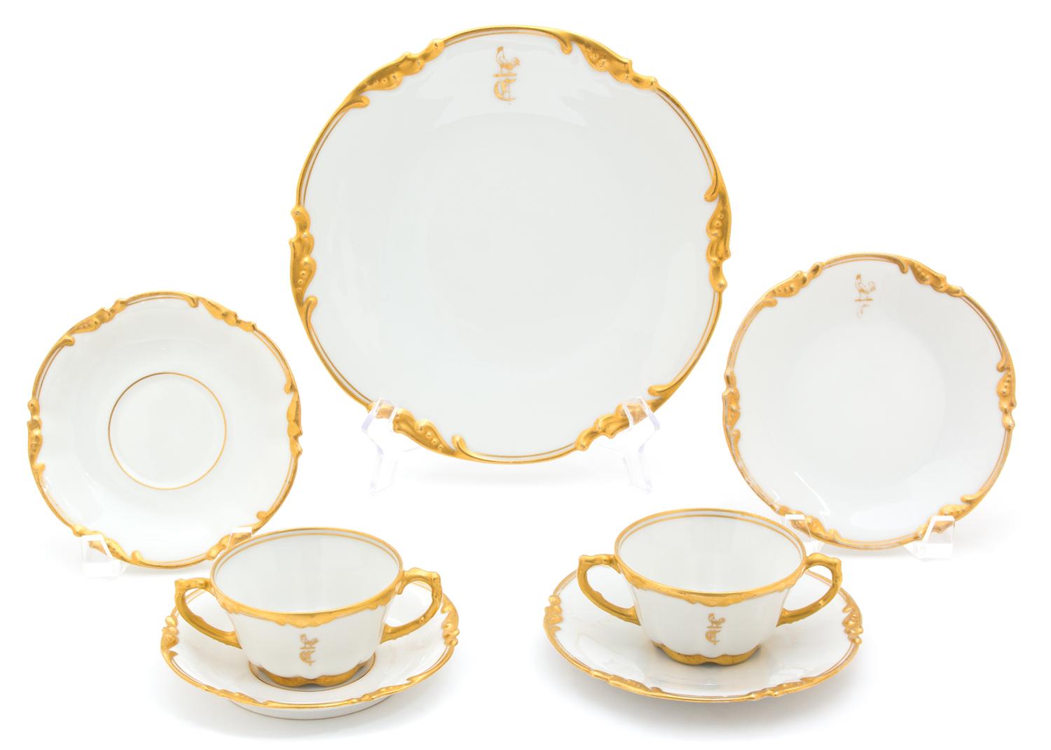 A Limoges Porcelain Partial Dinner Service Dinner plate diameter 9 1/2 inches.