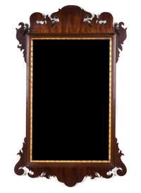 An American George III Style Parcel Gilt Mahogany Mirror 36 x 22 inches.