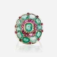 A green beryl, ruby, and ten karat white gold ring