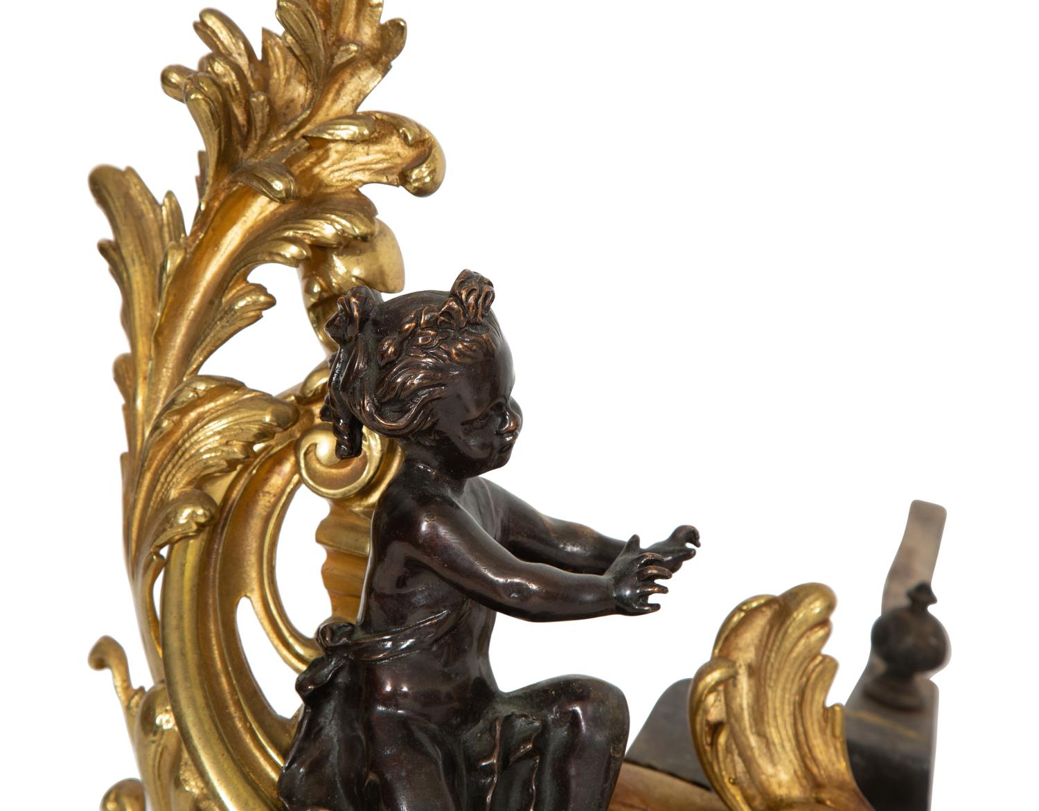 A Pair of Louis XV Style Gilt and Patinated Bronze Chenets
