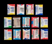 A Large Collection of Unopened and Sealed 1970s and 1980s Topps Football Wax Packs
