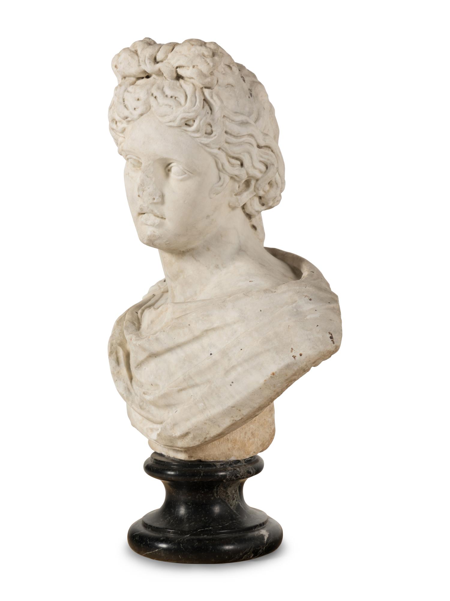 A Continental Carved Marble Bust of the Apollo Belvedere