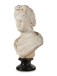 A Continental Carved Marble Bust of the Apollo Belvedere