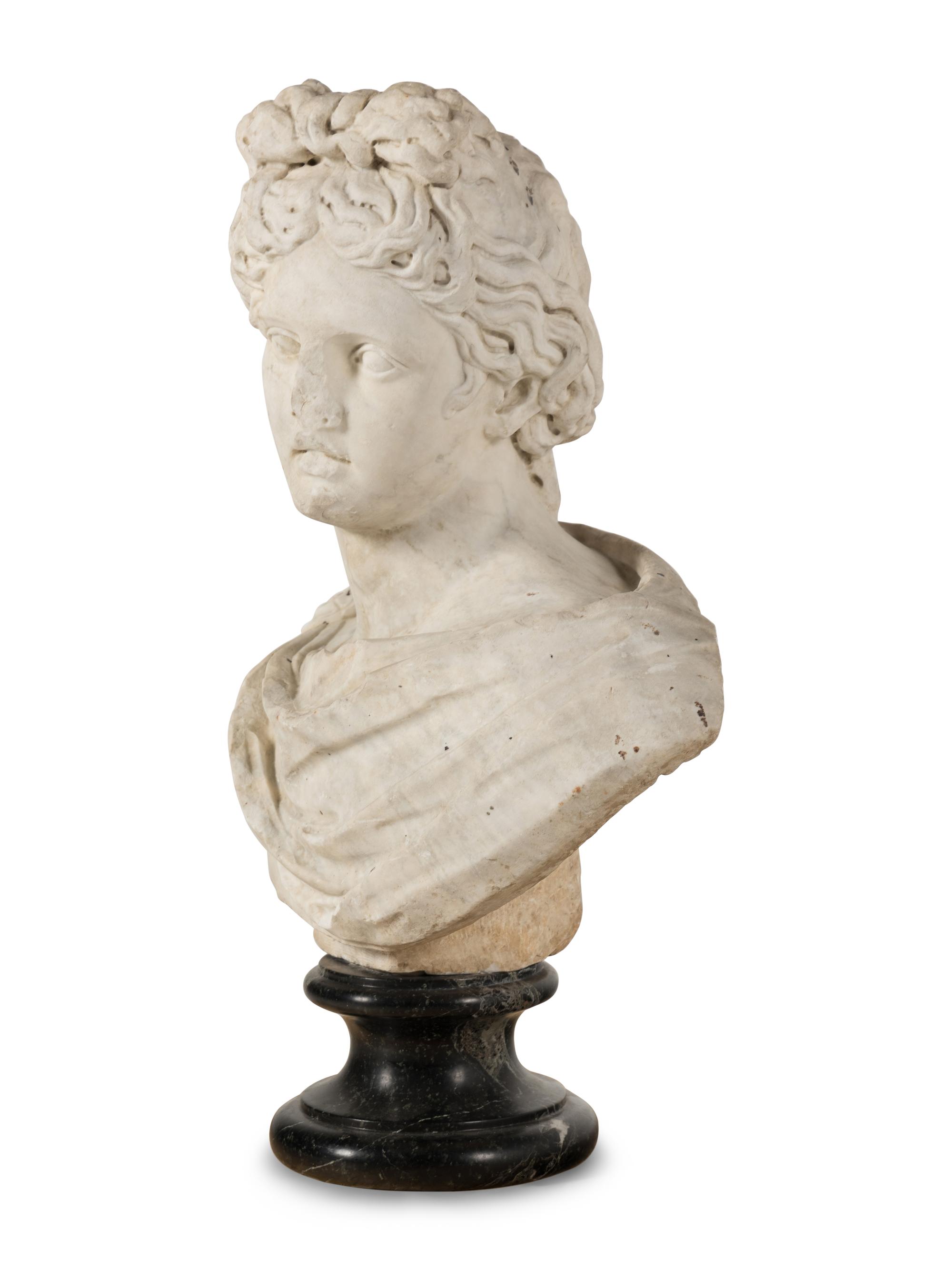 A Continental Carved Marble Bust of the Apollo Belvedere