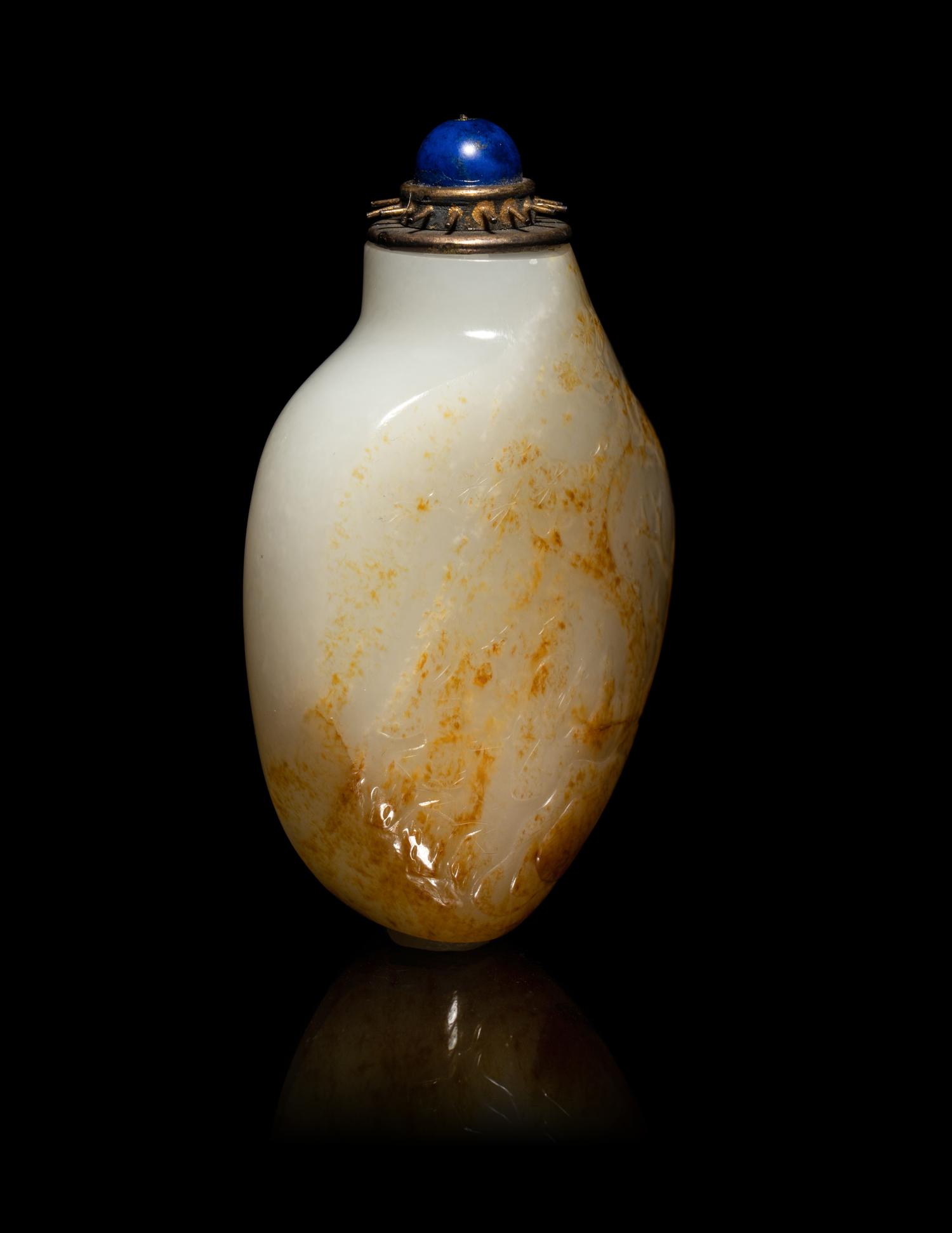 A Chinese Russet and White Jade 'Fishing' Snuff Bottle