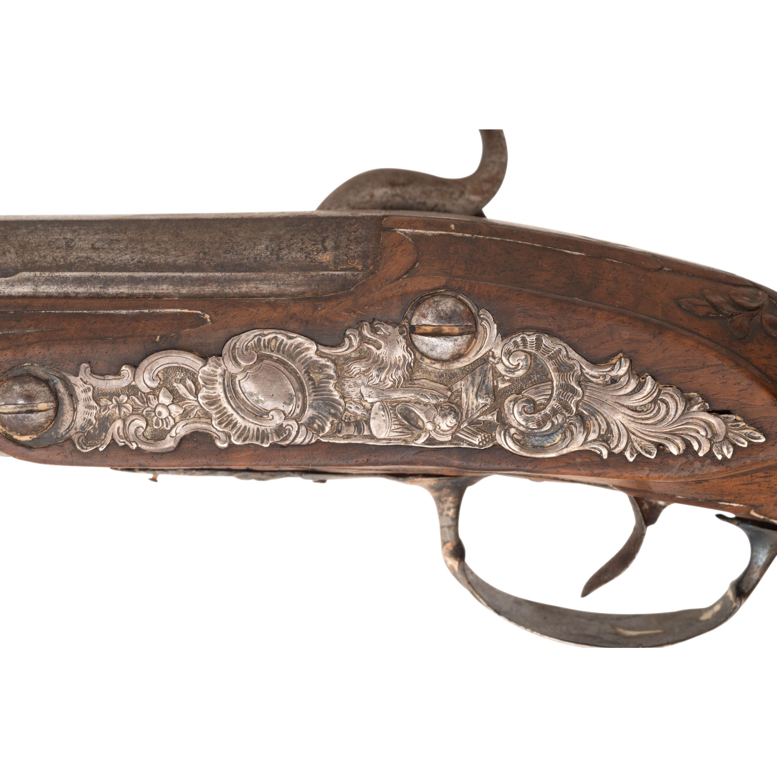 A Pair of Silver Mounted French Percussion Pistols