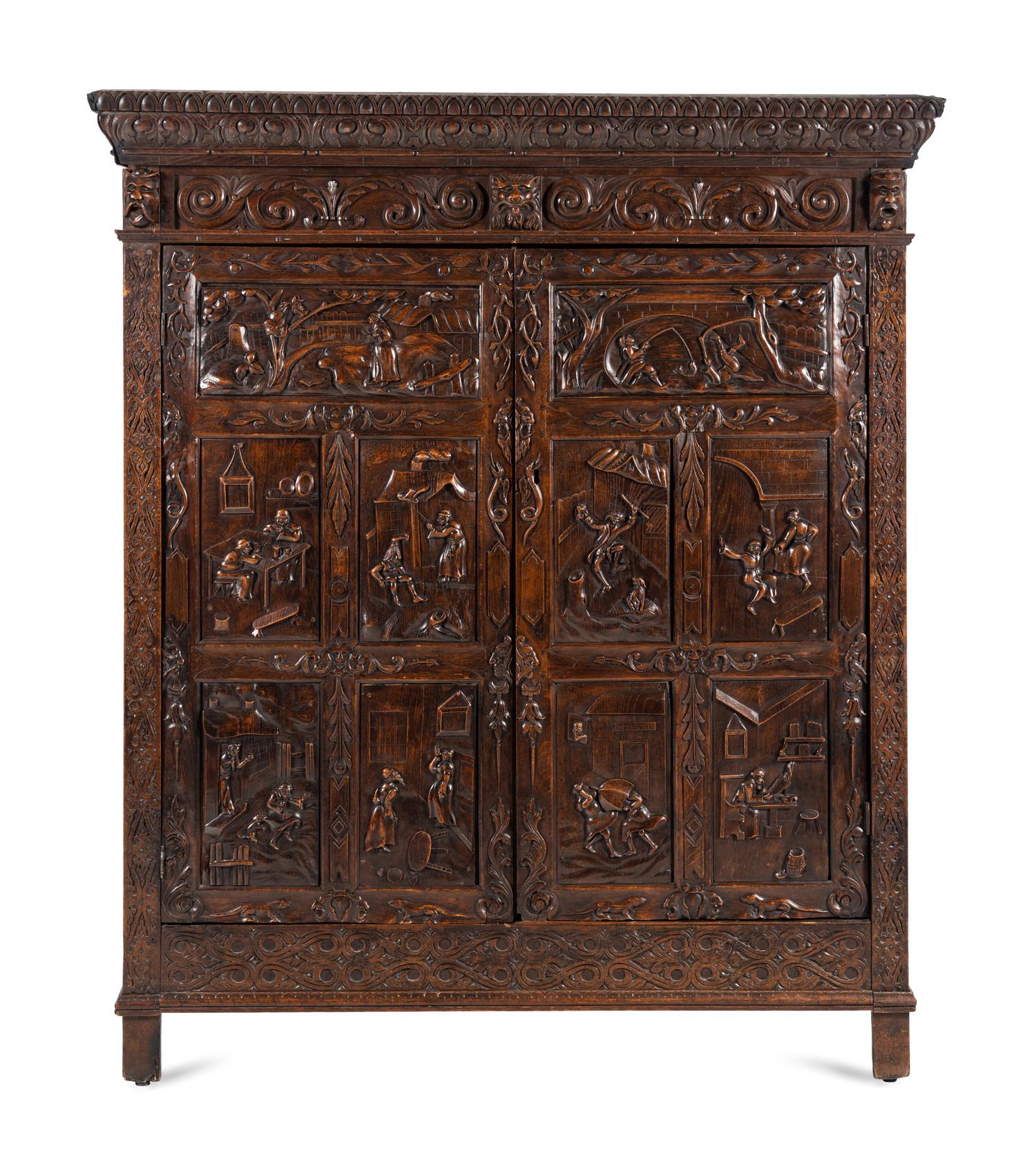 A Continental Carved Oak Wardrobe Cabinet