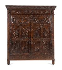 A Continental Carved Oak Wardrobe Cabinet