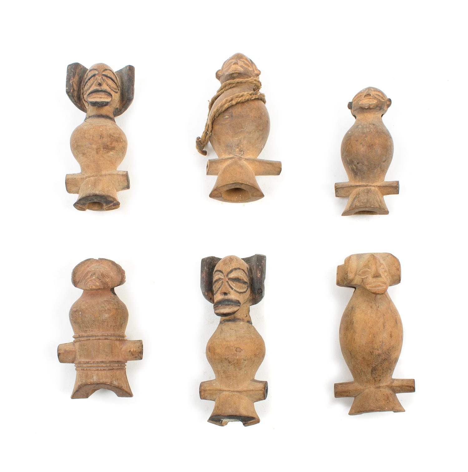 Six Chokwe Wood Whistles Height of largest example 3 3/8 inches. — FIRST QUARTER 20TH CENTURY
