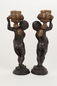 A Pair of Gilt and Patinated Bronze Figures of Cherubs