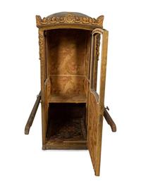A Venetian Carved and Painted Giltwood Sedan Chair