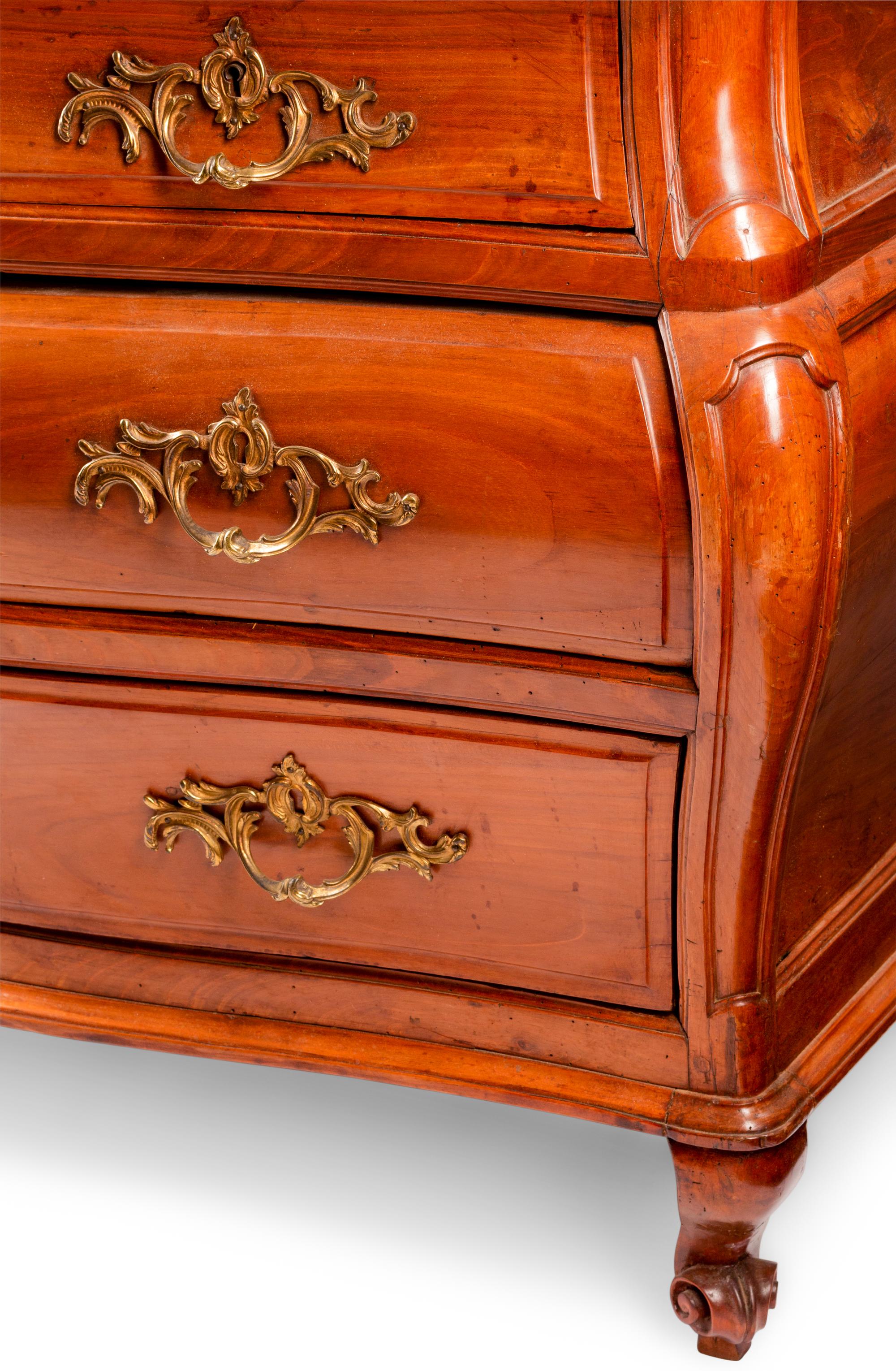 A French Provincial Walnut Bombe Commode