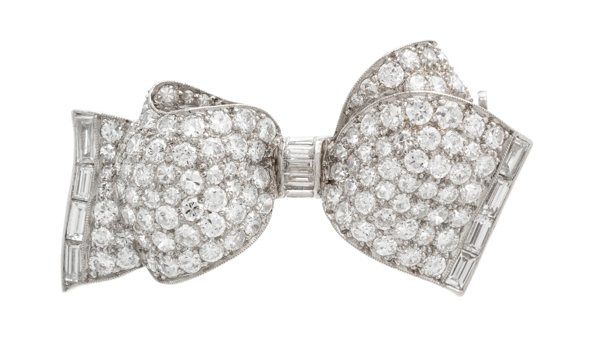 A Platinum and Diamond Bow Brooch, 4.40 dwts.