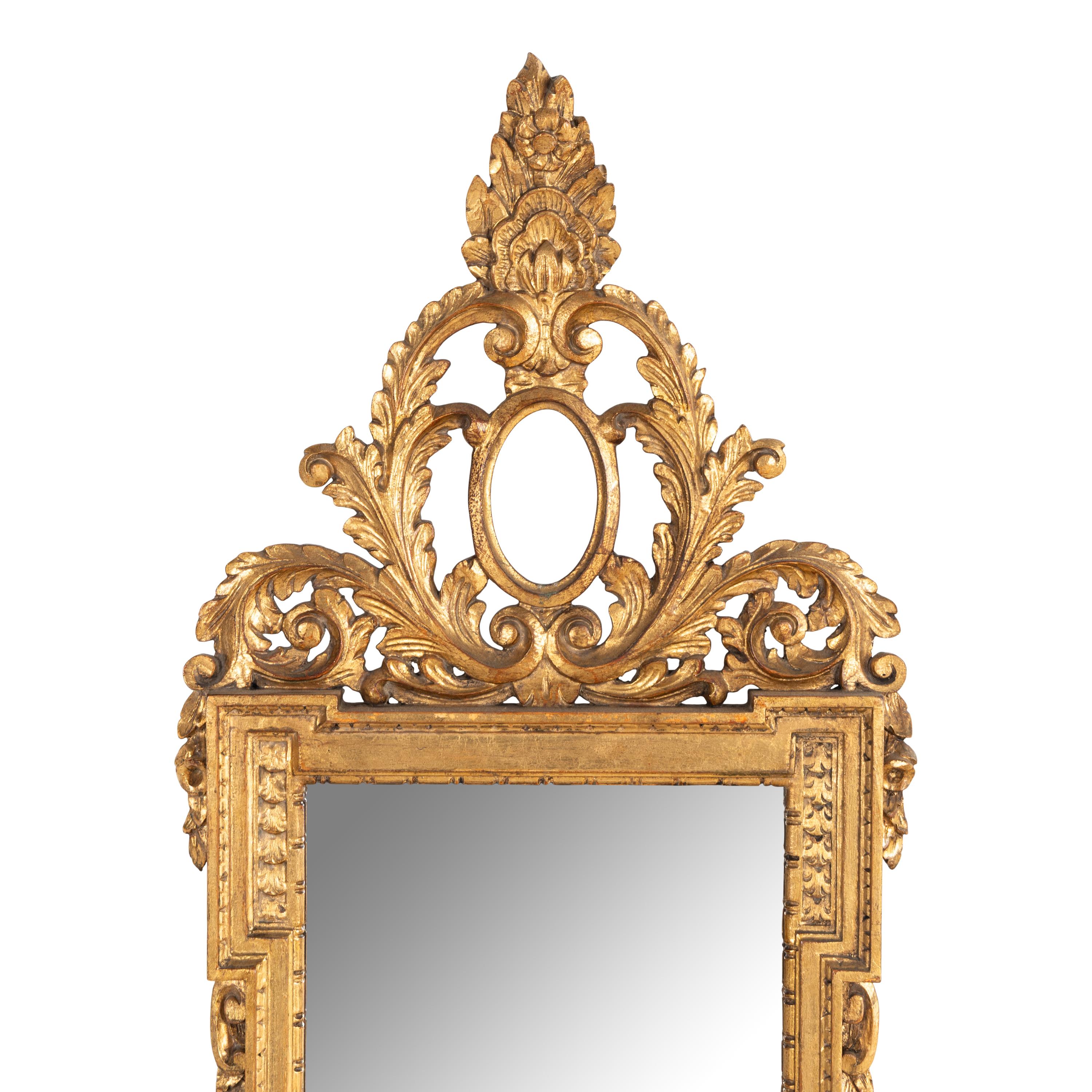 An Italian Baroque Style Giltwood Mirror