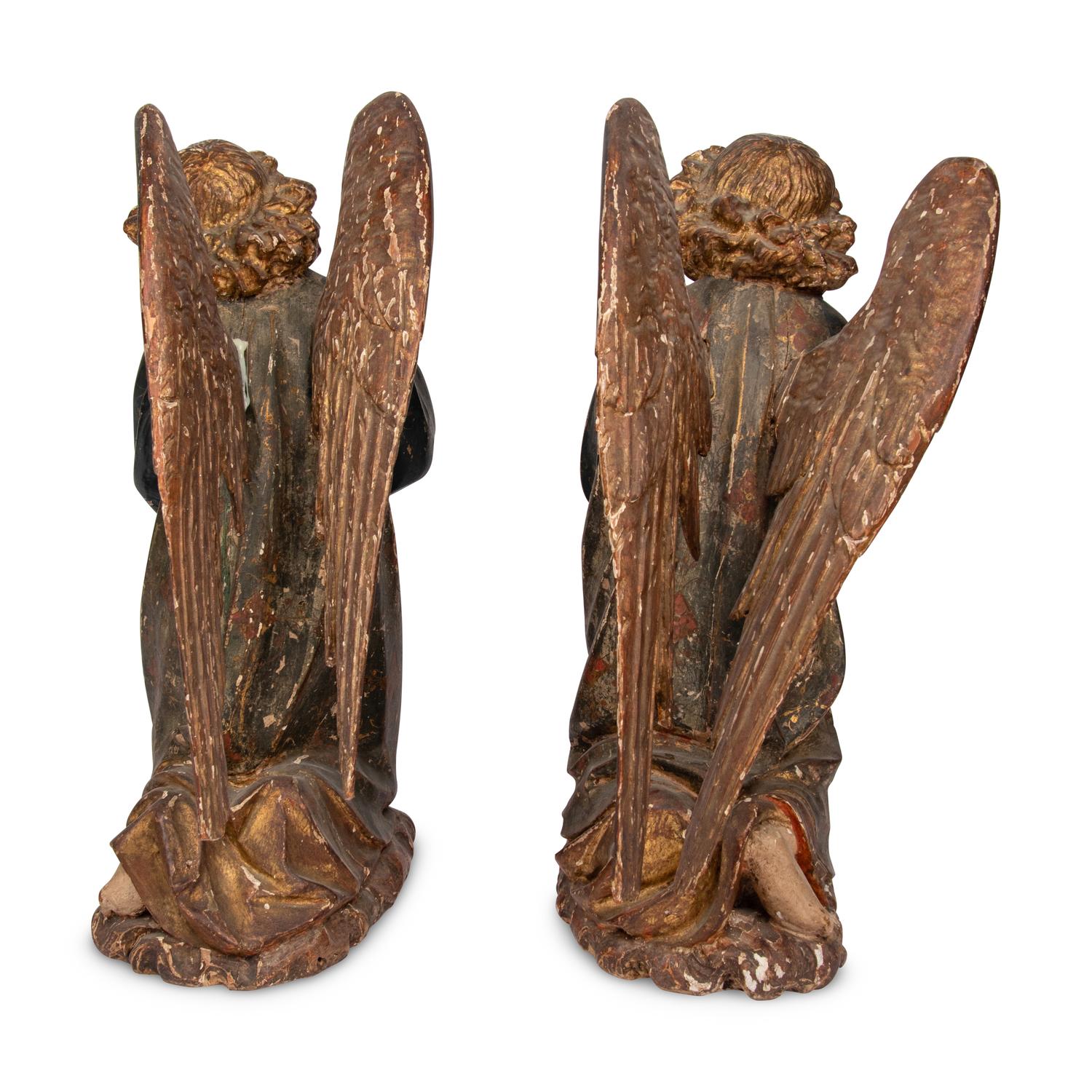 A Pair of Carved and Polychrome Decorated Figures of Kneeling Angels
