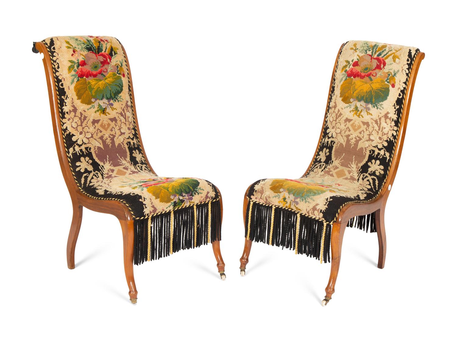 A Pair of Danish Walnut Slipper Chairs with Needlepoint Upholstery