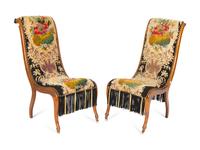 A Pair of Danish Walnut Slipper Chairs with Needlepoint Upholstery