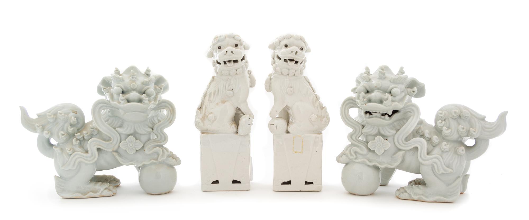 Two Pairs of Blanc-de-Chine Porcelain Figures of Fu Lions Height 8 1/4 inches. — 19TH CENTURY