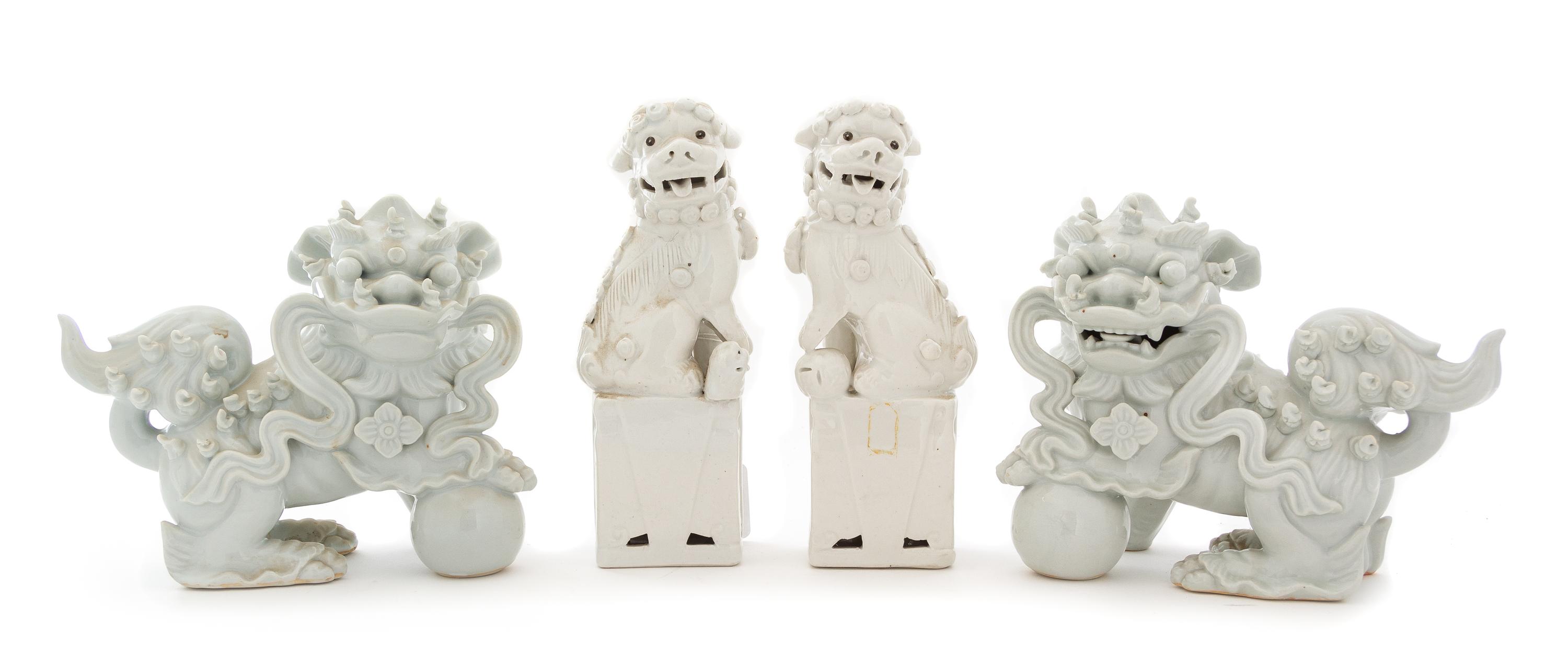 Two Pairs of Blanc-de-Chine Porcelain Figures of Fu Lions Height 8 1/4 inches. — 19TH CENTURY