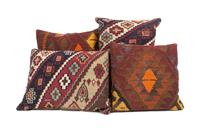 A Collection of Four Kilim Upholstered Pillows Height of largest 16 inches.