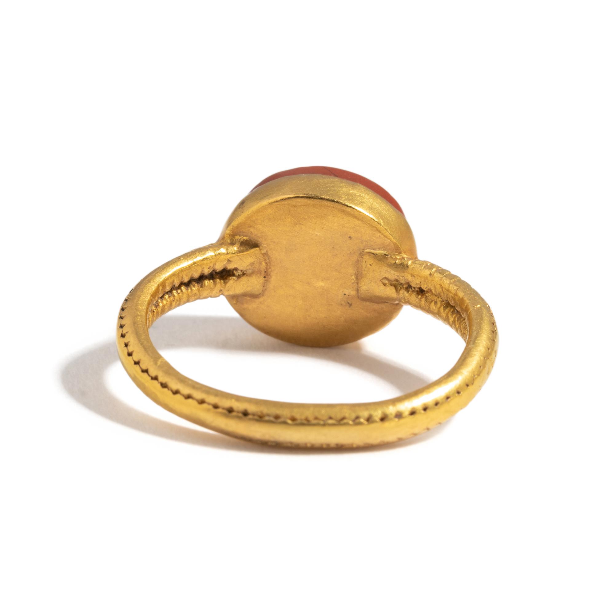 A Roman Gold and Red Jasper Ring Stone with a Portrait Head of an Athlete
