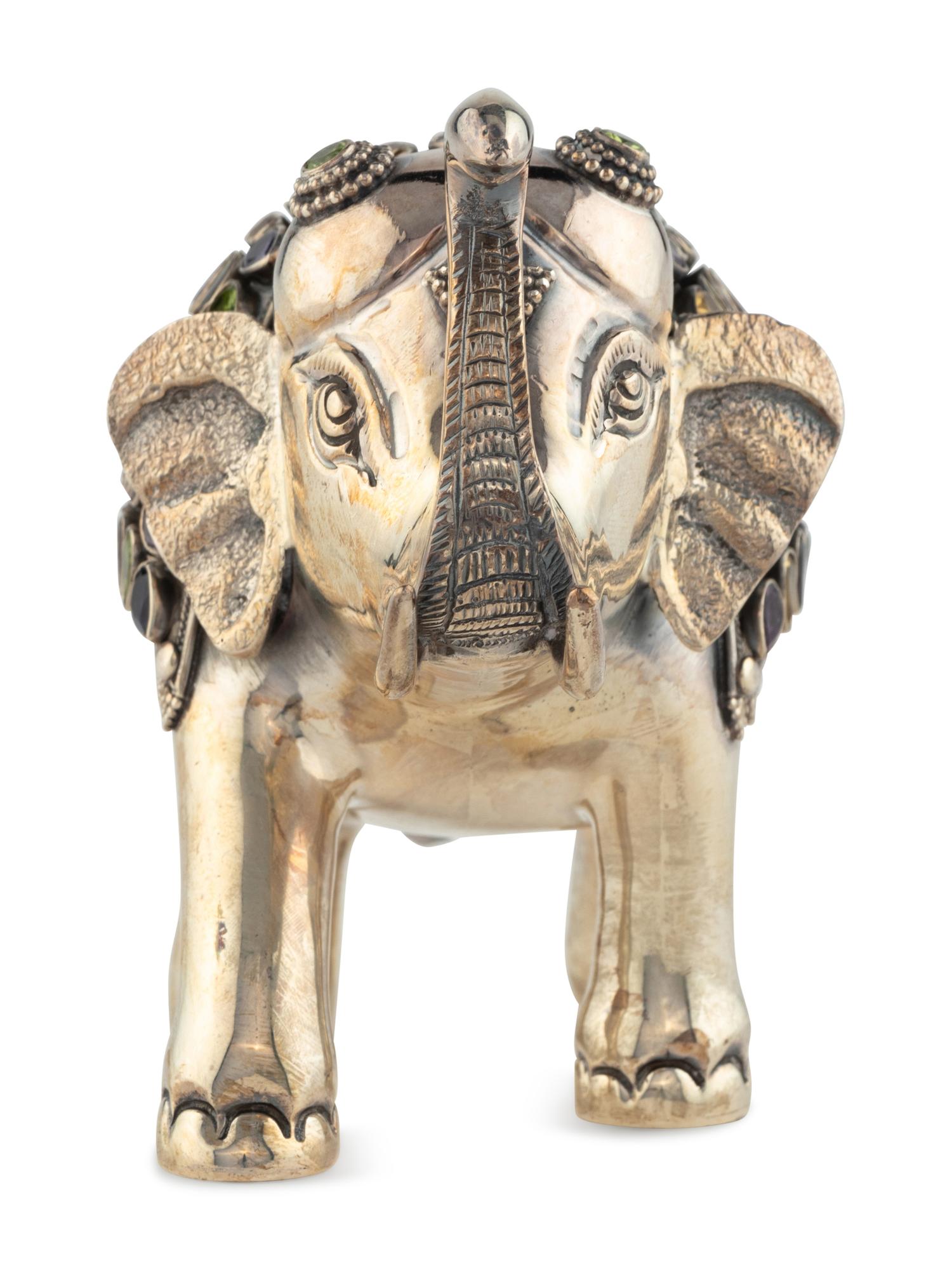 An East Indian Silver Plated and Jeweled Figure of an Elephant