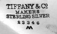 An American Silver Dish, Tiffany & Co., New York, NY, of oval form with flared edges and raised on four ball feet.