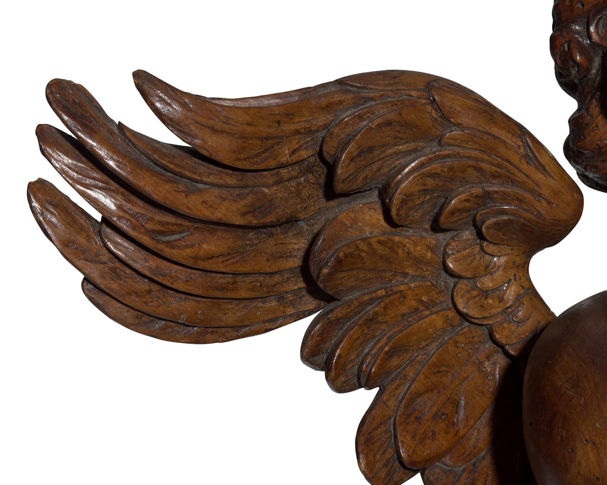 An Italian Baroque carved walnut angel, 17th century