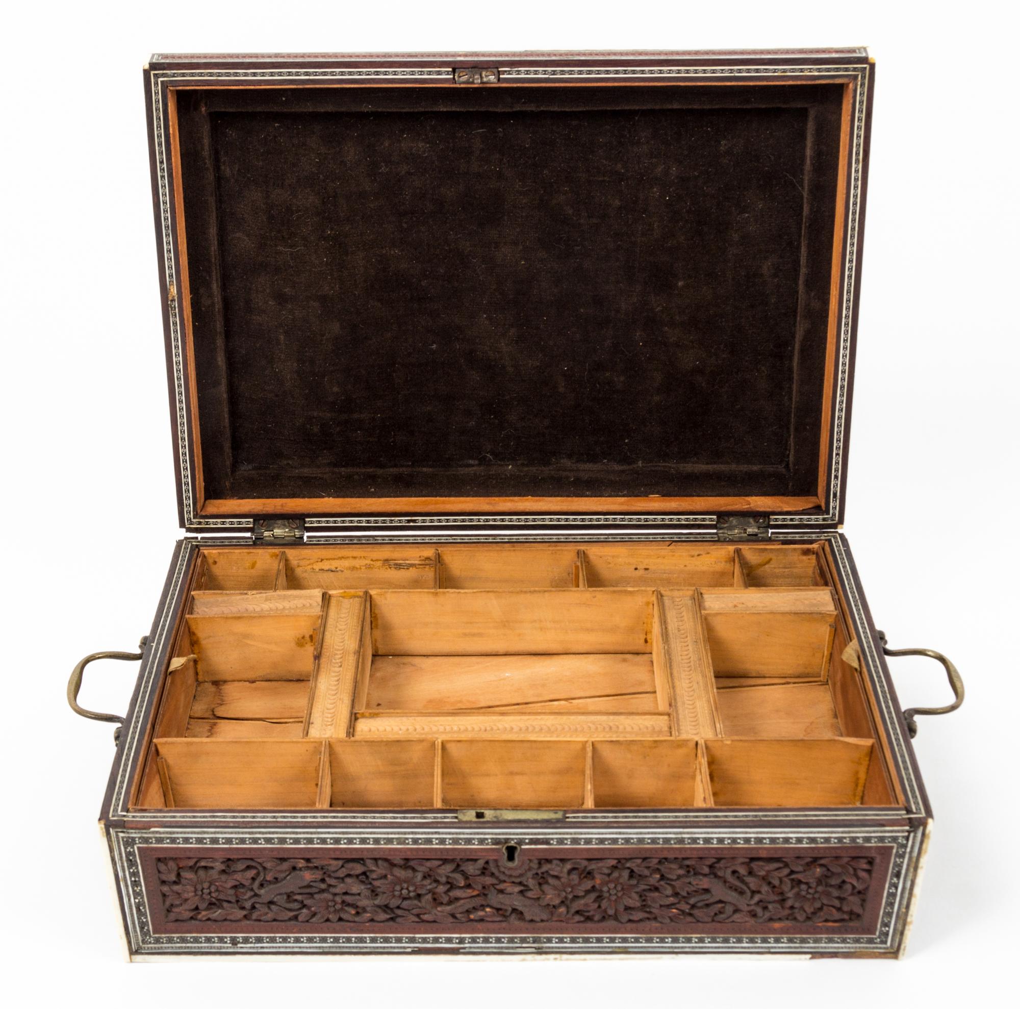 A Carved Wood Sewing Box Height 4 1/2 x width 12 7/8 x depth 9 1/4 inches.