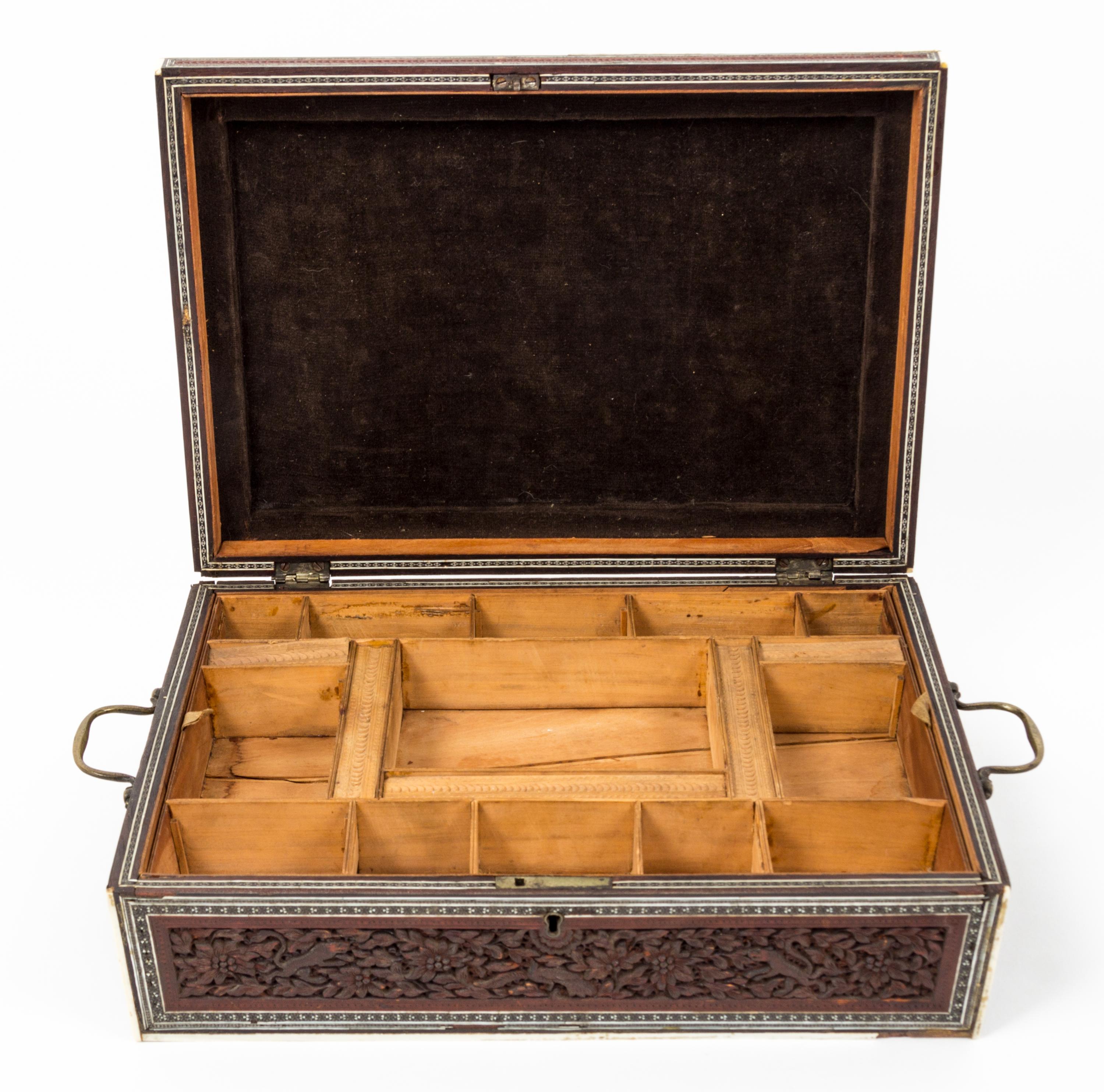 A Carved Wood Sewing Box Height 4 1/2 x width 12 7/8 x depth 9 1/4 inches.